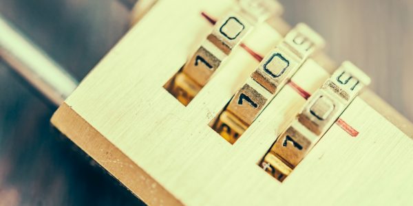 Close up pad lock on wooden background - vintage effect style pictures